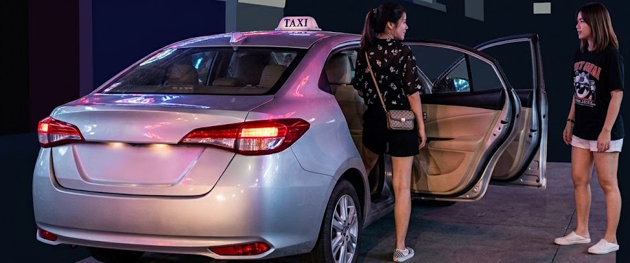 Woman stepping into taxi